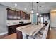 Beautiful kitchen island with granite countertops and a breakfast bar at 12134 Creek Preserve Dr, Riverview, FL 33579