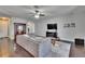 Comfortable living room features dark hardwood floors and a ceiling fan at 12134 Creek Preserve Dr, Riverview, FL 33579