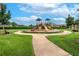 Community playground with slides, climbing structure and swings for neighborhood  at 12134 Creek Preserve Dr, Riverview, FL 33579
