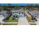 An eye-level aerial view of the two story home, with a three car garage and nice landscaping at 12134 Creek Preserve Dr, Riverview, FL 33579