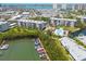 Aerial view of property including the building, boat docks, pool and surrounding waterways at 1328 Pasadena S Ave # 608, South Pasadena, FL 33707