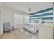 Inviting bedroom with a soothing blue and white palette and a coastal-themed decor at 1328 Pasadena S Ave # 608, South Pasadena, FL 33707