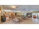 Community room with wicker seating and a partial view of the kitchen at 1328 Pasadena S Ave # 608, South Pasadena, FL 33707