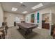 Spacious game room featuring a pool table, chairs, and an adjacent office area, great for recreation at 1328 Pasadena S Ave # 608, South Pasadena, FL 33707