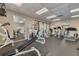 Well-equipped gym featuring machines, weights, mirrors, and rubber flooring for a complete fitness experience at 1328 Pasadena S Ave # 608, South Pasadena, FL 33707