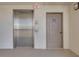 Hallway with an elevator and bicycle storage door at 1328 Pasadena S Ave # 608, South Pasadena, FL 33707