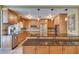 Spacious kitchen featuring stainless steel appliances, granite countertops, and ample cabinetry at 1328 Pasadena S Ave # 608, South Pasadena, FL 33707