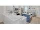 Open kitchen with stainless appliances, granite countertops and a kitchen island with seating at 1328 Pasadena S Ave # 608, South Pasadena, FL 33707