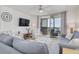 Comfortable living room featuring beach themed decor and access to the outdoor patio at 1328 Pasadena S Ave # 608, South Pasadena, FL 33707