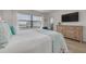 Tranquil main bedroom with serene waterfront views and ample natural light at 1328 Pasadena S Ave # 608, South Pasadena, FL 33707