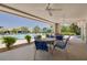 Covered patio area with comfortable seating overlooking the pool, ideal for relaxing and entertaining guests at 1328 Pasadena S Ave # 608, South Pasadena, FL 33707
