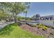Entrance sign for Pasadena Cove, a beautiful community with lush landscaping at 1328 Pasadena S Ave # 608, South Pasadena, FL 33707