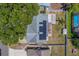 Aerial view of home featuring solar panels and a fenced backyard at 135 Coral Dr, Safety Harbor, FL 34695