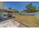The backyard features a concrete patio and new vinyl fence at 135 Coral Dr, Safety Harbor, FL 34695