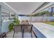 Outdoor seating area has view of the fenced backyard at 135 Coral Dr, Safety Harbor, FL 34695
