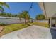 Open backyard featuring a concrete patio and privacy fence at 135 Coral Dr, Safety Harbor, FL 34695