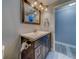 Bathroom featuring modern vanity, updated mirror and lighting fixtures at 135 Coral Dr, Safety Harbor, FL 34695