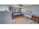 Bedroom featuring a ceiling fan, light grey walls and a neutral color palette at 135 Coral Dr, Safety Harbor, FL 34695