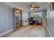 Bedroom with desk, storage and gray plank flooring at 135 Coral Dr, Safety Harbor, FL 34695