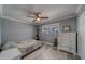 Cozy bedroom with neutral decor, ceiling fan and light gray walls at 135 Coral Dr, Safety Harbor, FL 34695