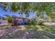Charming home boasting lush landscaping and a well-manicured front lawn at 135 Coral Dr, Safety Harbor, FL 34695