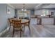 Eat-in kitchen features wood table, sliding glass doors, granite counters and stainless appliances at 135 Coral Dr, Safety Harbor, FL 34695