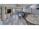 Inviting living room with stylish furniture, modern floors, and ample natural light at 135 Coral Dr, Safety Harbor, FL 34695