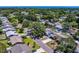 Aerial view of a quiet neighborhood with mature trees and well-maintained homes at 135 Coral Dr, Safety Harbor, FL 34695