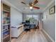 Home office featuring modern desk space, a bookcase and a ceiling fan at 135 Coral Dr, Safety Harbor, FL 34695