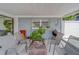Covered patio boasts outdoor furniture and ample space for entertaining at 135 Coral Dr, Safety Harbor, FL 34695