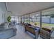 Enclosed patio with comfortable sofa and tile flooring at 135 Coral Dr, Safety Harbor, FL 34695