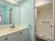 The bathroom has a single sink vanity and walk-in shower at 1472 Mission Hills Blvd # 24F, Clearwater, FL 33759