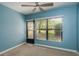 Bright bedroom with a ceiling fan and a large window offering lots of natural light at 1472 Mission Hills Blvd # 24F, Clearwater, FL 33759