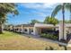 Charming single-story home with a covered carport and well-maintained landscaping, nestled under a bright blue sky at 1472 Mission Hills Blvd # 24F, Clearwater, FL 33759