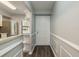 Bright foyer leading into kitchen with breakfast bar and stainless steel appliances, accentuated by stylish flooring at 1472 Mission Hills Blvd # 24F, Clearwater, FL 33759