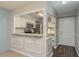 Cozy kitchen view showcasing breakfast bar, stainless steel appliances, and easy access from the entry at 1472 Mission Hills Blvd # 24F, Clearwater, FL 33759