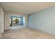 Spacious living room with ample natural light and an open doorway to an additional living area at 1472 Mission Hills Blvd # 24F, Clearwater, FL 33759
