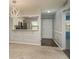 Inviting living space featuring a breakfast bar view to the kitchen, complemented by modern decor and ample lighting at 1472 Mission Hills Blvd # 24F, Clearwater, FL 33759