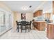 Open-concept dining area with a stylish table and chairs adjacent to the kitchen at 16309 Caliente Pl, Tampa, FL 33624