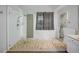 Contemporary bathroom boasts a frameless glass shower and stylish tile flooring at 17124 Falconridge Rd, Lithia, FL 33547
