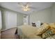 Bedroom with bed, ceiling fan, dresser, closet, and desk at 17124 Falconridge Rd, Lithia, FL 33547