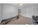 Minimalist bedroom with neutral carpet, closet, and ceiling fan at 17124 Falconridge Rd, Lithia, FL 33547
