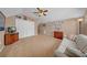 Bright bonus room with neutral carpet, sofa, and plenty of space for relaxation at 17124 Falconridge Rd, Lithia, FL 33547