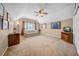 Spacious bonus room with a ceiling fan, neutral paint, and a large window for ample light at 17124 Falconridge Rd, Lithia, FL 33547