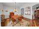 Inviting dining room featuring traditional furniture, chandelier lighting, and views into the living space at 17124 Falconridge Rd, Lithia, FL 33547