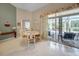 Bright dining room featuring tile floors and sliding glass doors to an outdoor patio at 17124 Falconridge Rd, Lithia, FL 33547