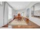 Elegant dining room with hardwood floors, a large window, and an adjacent sitting area at 17124 Falconridge Rd, Lithia, FL 33547