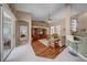 Bright living room featuring a wooden entertainment center, high ceilings, ceiling fan, and a comfortable sectional sofa at 17124 Falconridge Rd, Lithia, FL 33547