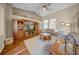 Spacious living room with hardwood floors, vaulted ceilings, and a large entertainment center at 17124 Falconridge Rd, Lithia, FL 33547