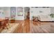 Bright and airy living space connecting to the dining room, featuring hardwood floors and neutral decor at 17124 Falconridge Rd, Lithia, FL 33547